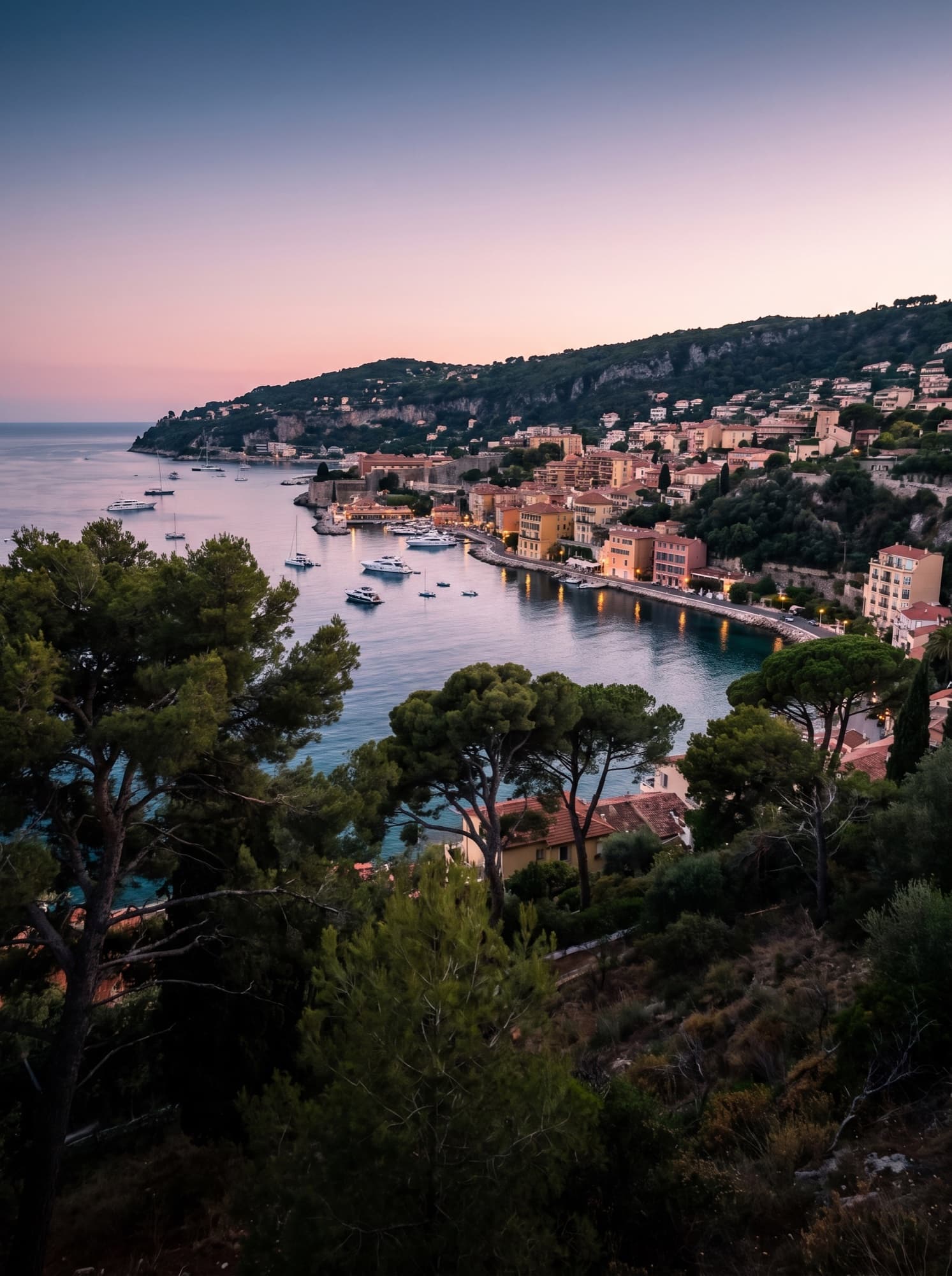 The bay of Villefranche-sur-Mer at dusk, seen from the corniche