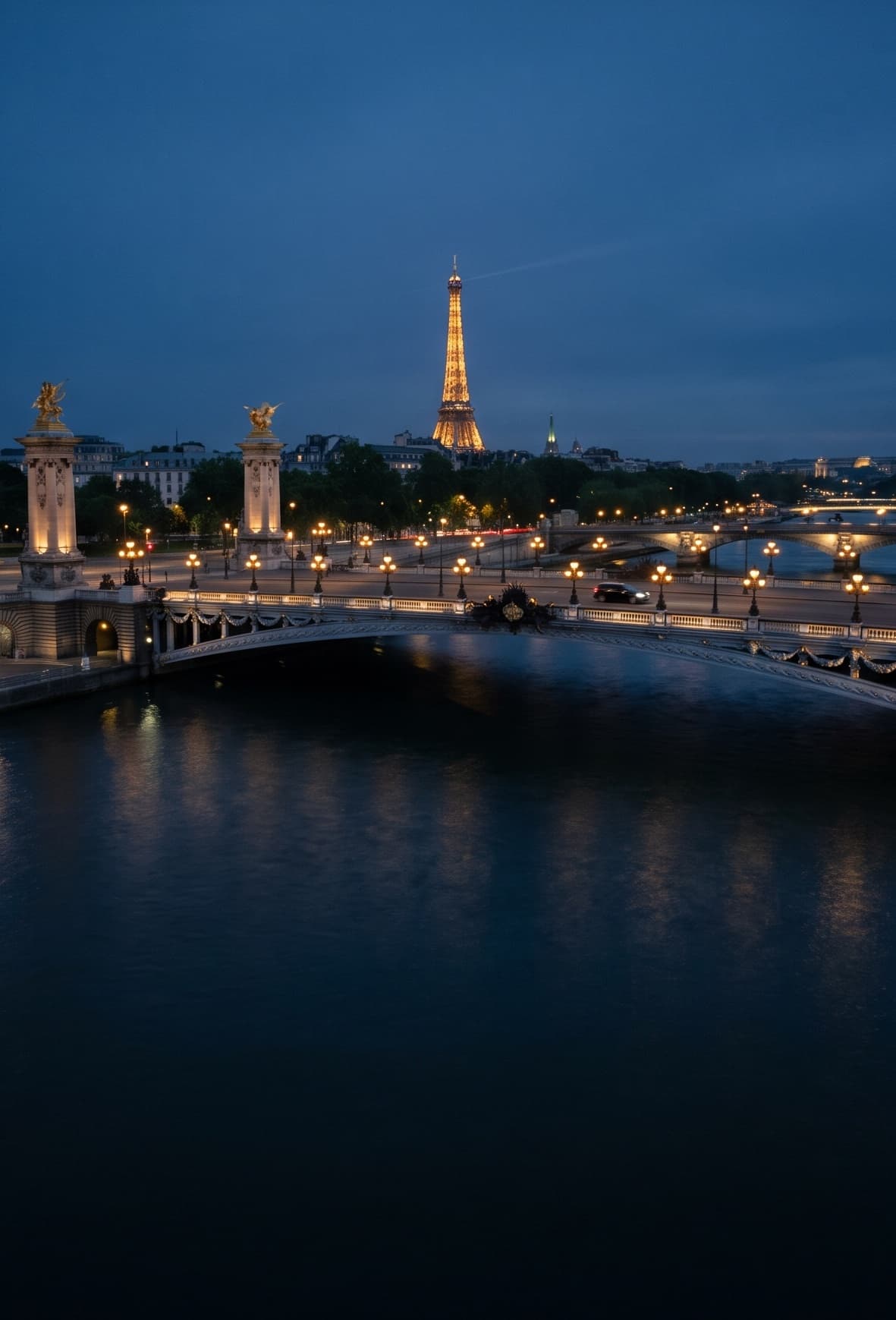 The Pont Alexandre III and the Eiffel Tower over the Seine, at blue hour